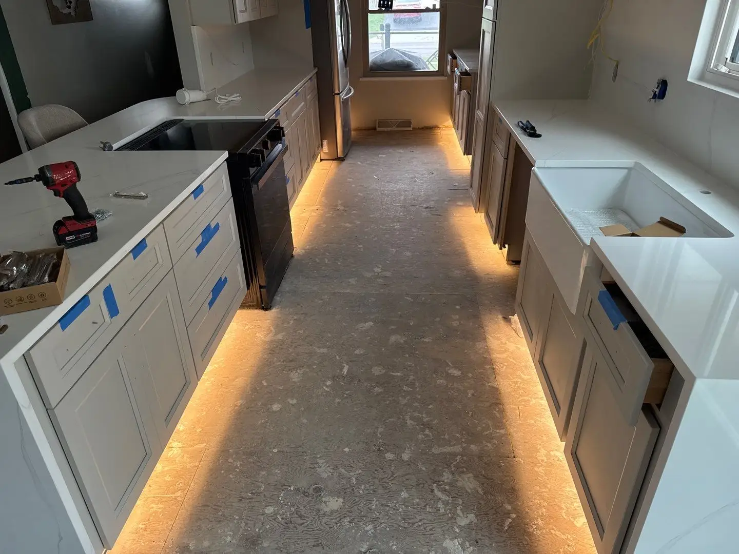 Remodeled kitchen with white cabinets and island