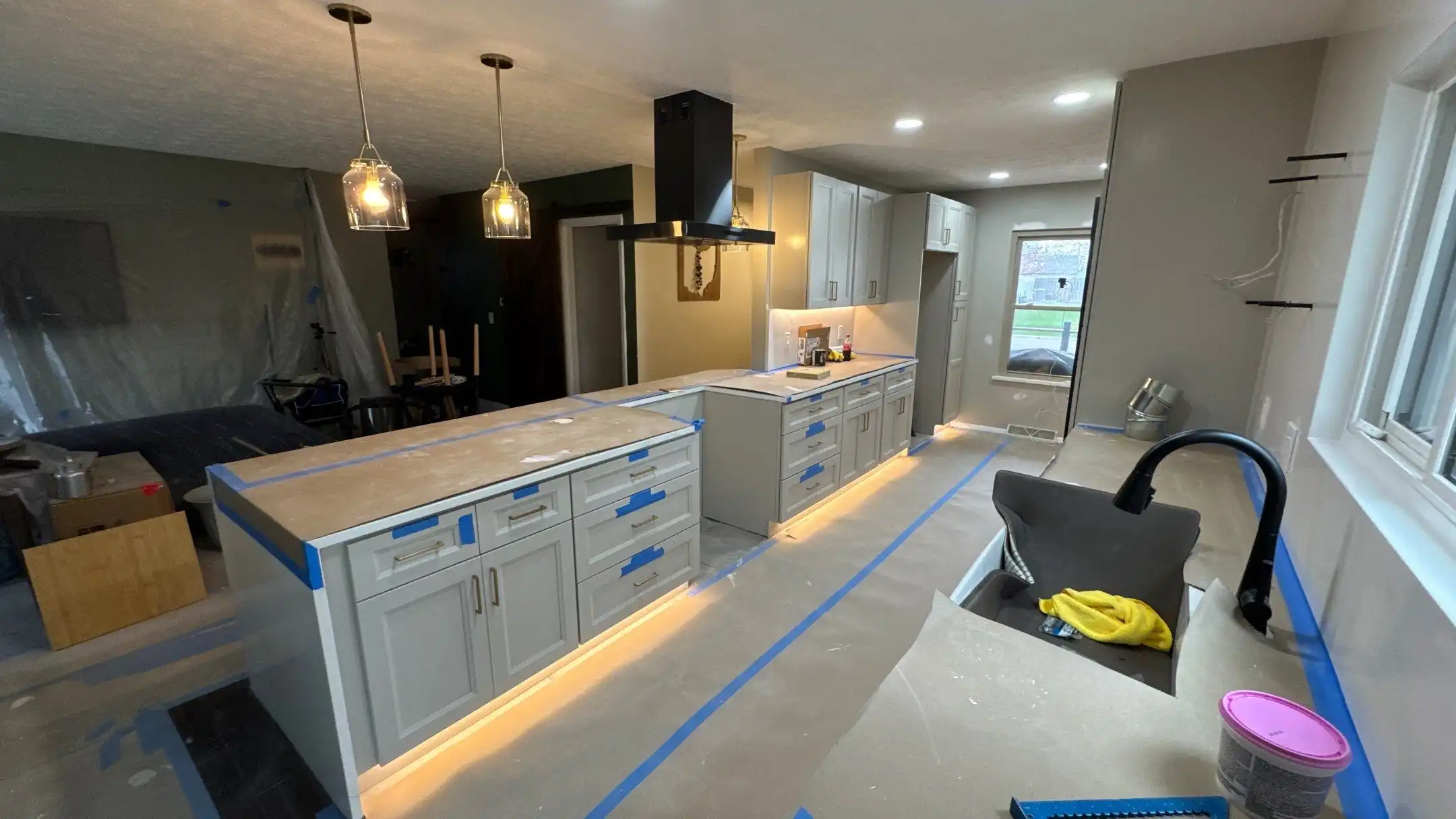 Kitchen remodel with island seating and pendant lights