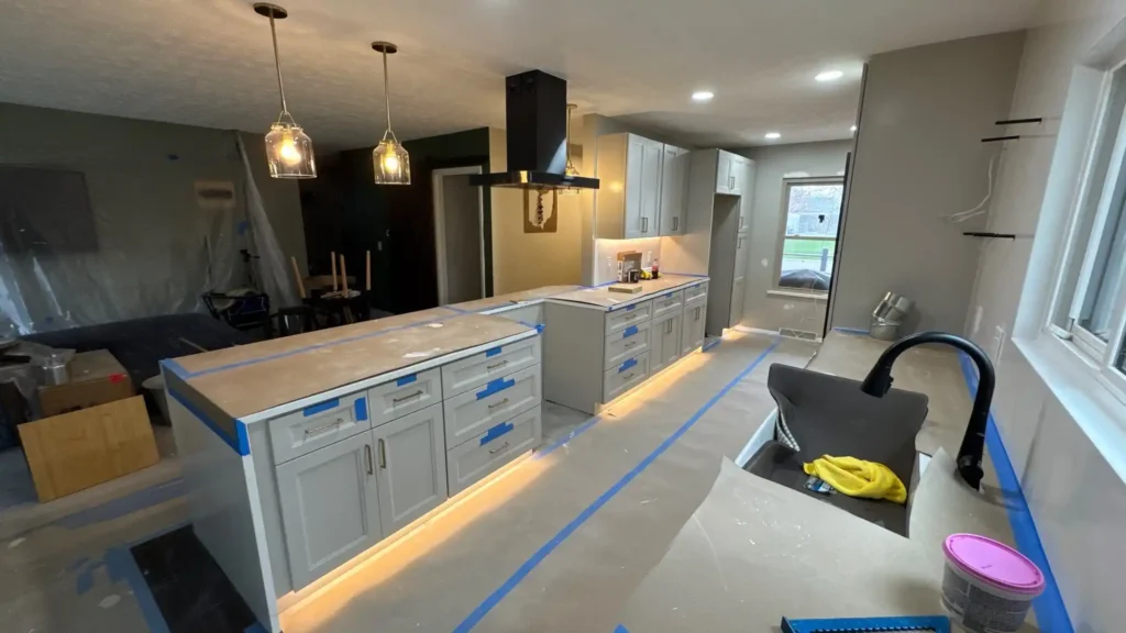 Kitchen island with quartz countertop and pendant lights